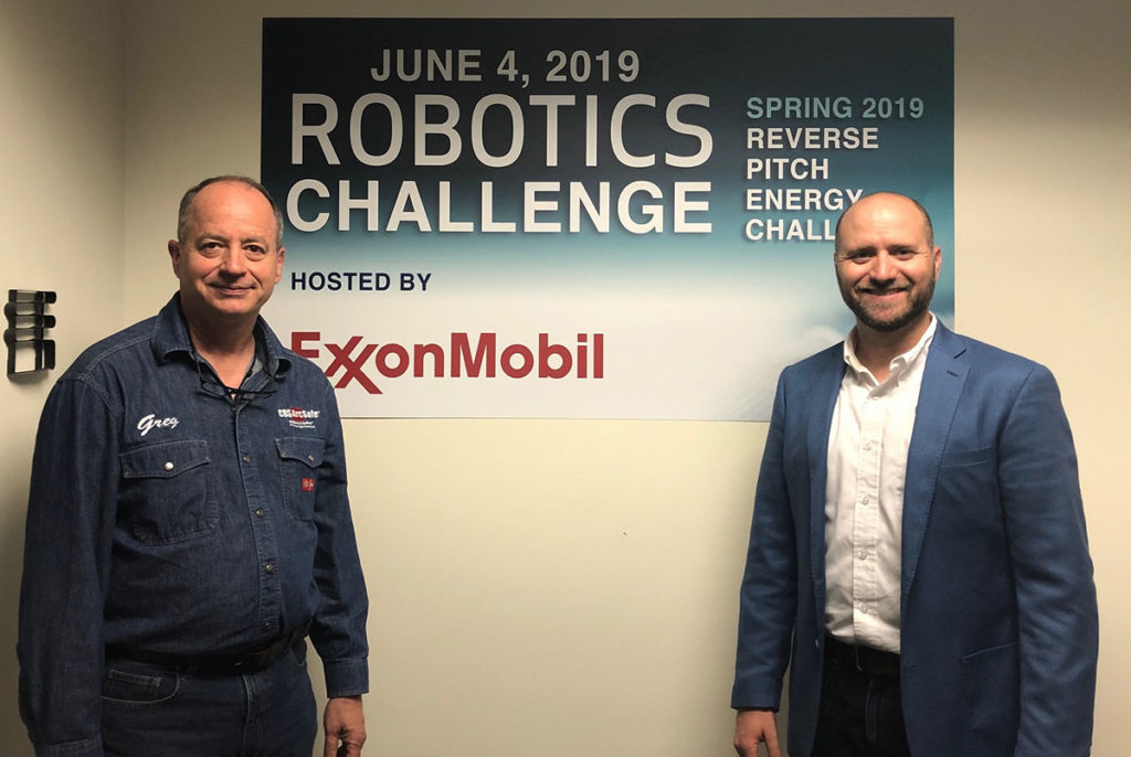 Two people at ExxonMobil Robotics Challenge event.