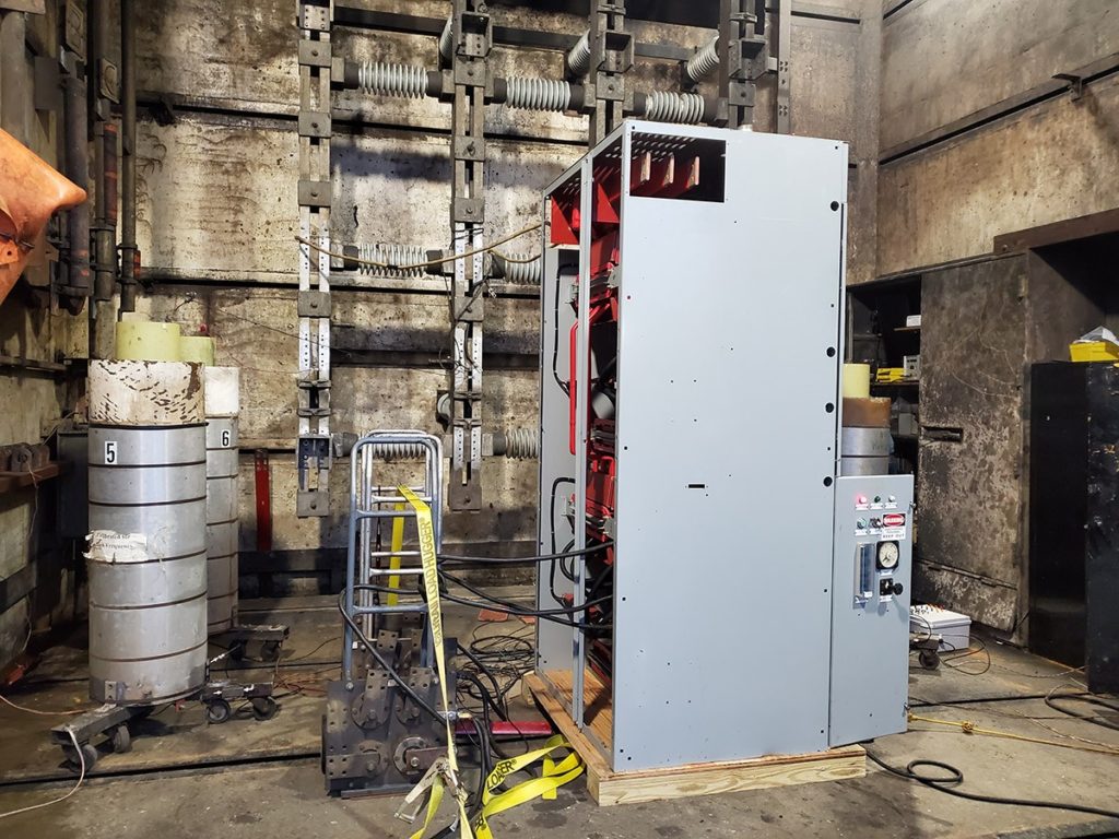 Industrial electrical equipment in a maintenance room.